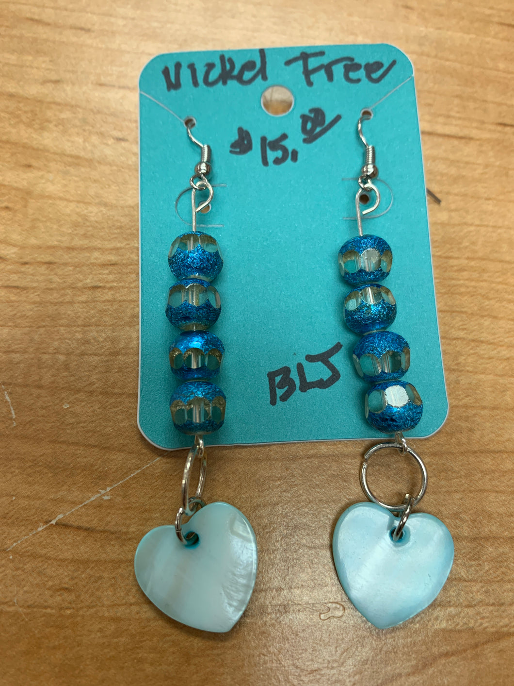 Handmade blue and clear beads with light blue heart